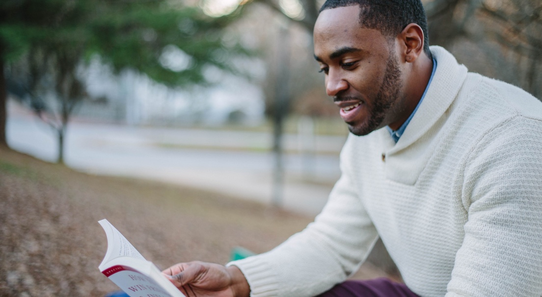 Picture of a person reading a book
